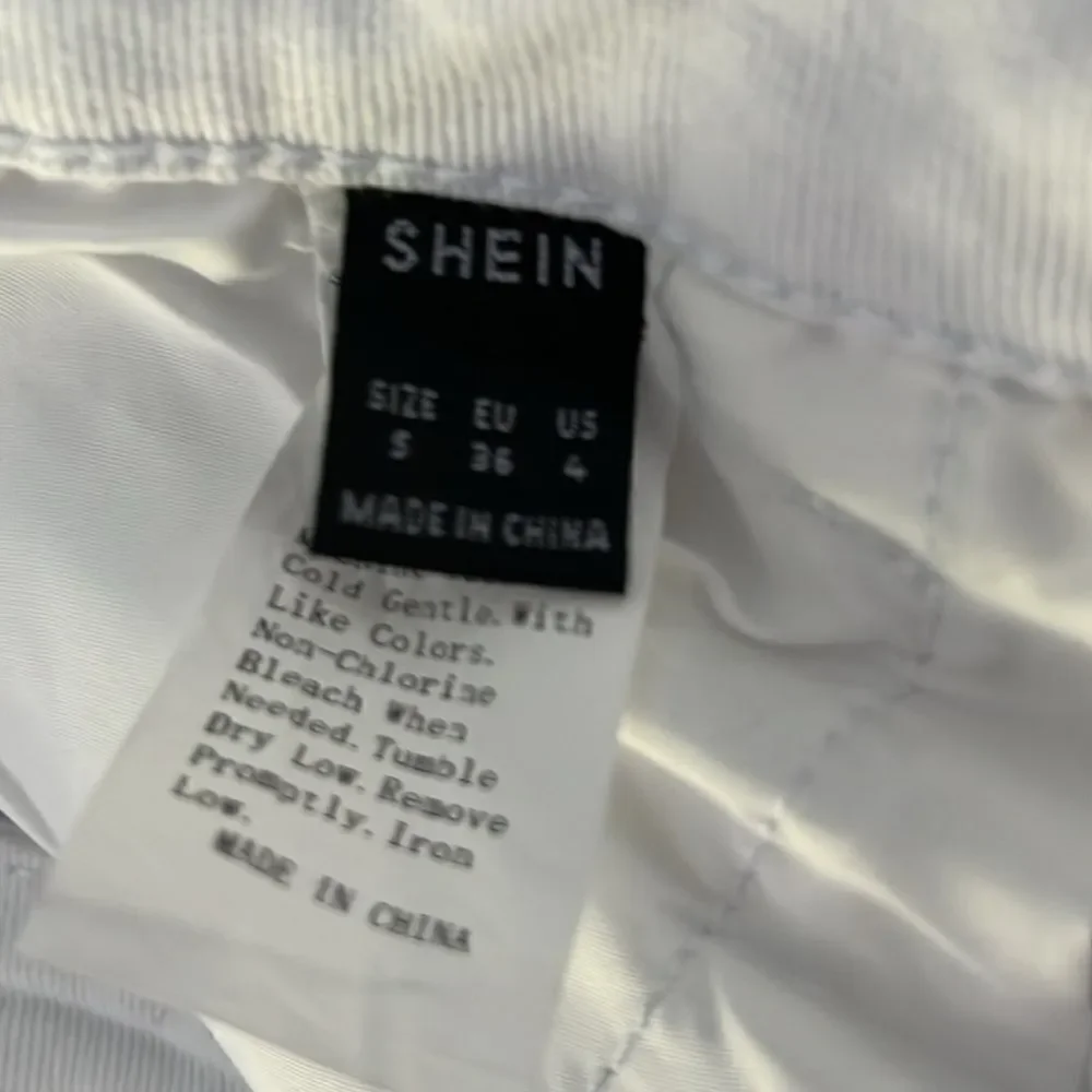 White SHEIN flare jeans